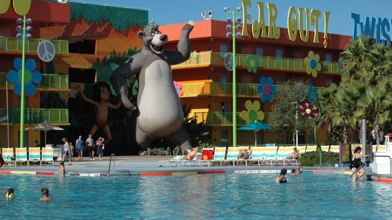 A pool at Pop Century with a large statue in the middle of it.